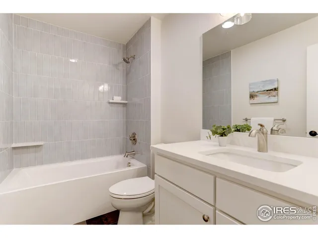 a bathroom with a sink a toilet and a bathtub