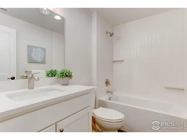 a bathroom with a sink a toilet and a bathtub