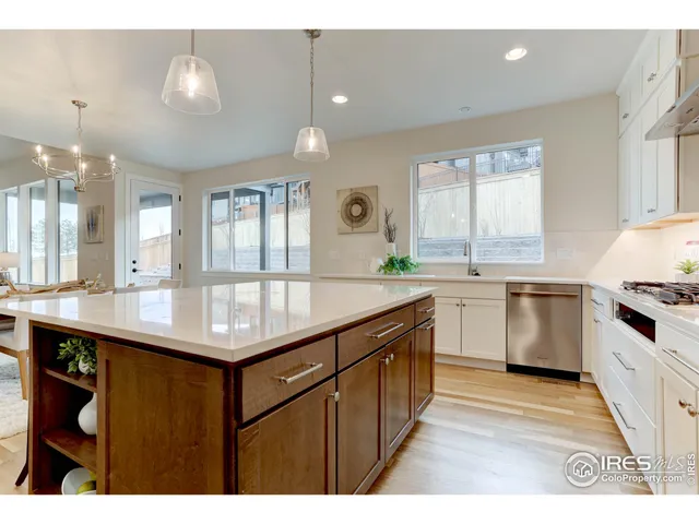 a kitchen with a sink cabinets and window