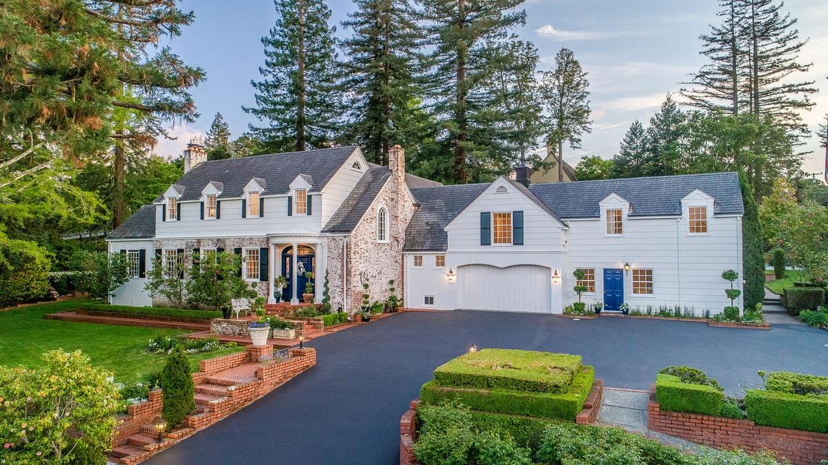 a front view of a house with garden