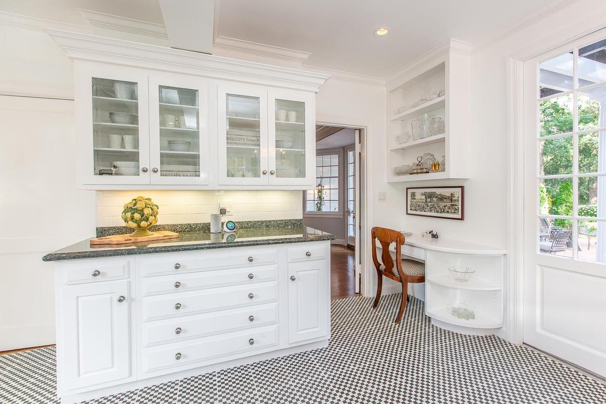 863 Chiltern Road Hillsborough, CA 94010 - Photo 17 of 50 a kitchen with granite countertop a stove a sink and a cabinets