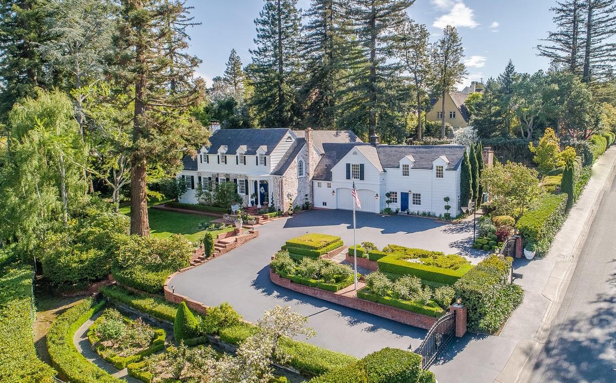 863 Chiltern Road Hillsborough, CA 94010 - Photo 2 of 50 an aerial view of a house with swimming pool and large trees
