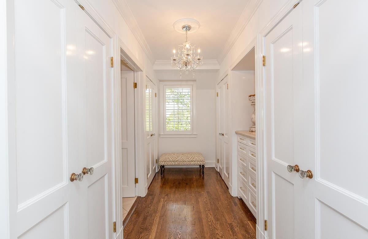 863 Chiltern Road Hillsborough, CA 94010 - Photo 28 of 50 a view of a hallway with wooden floor and staircase