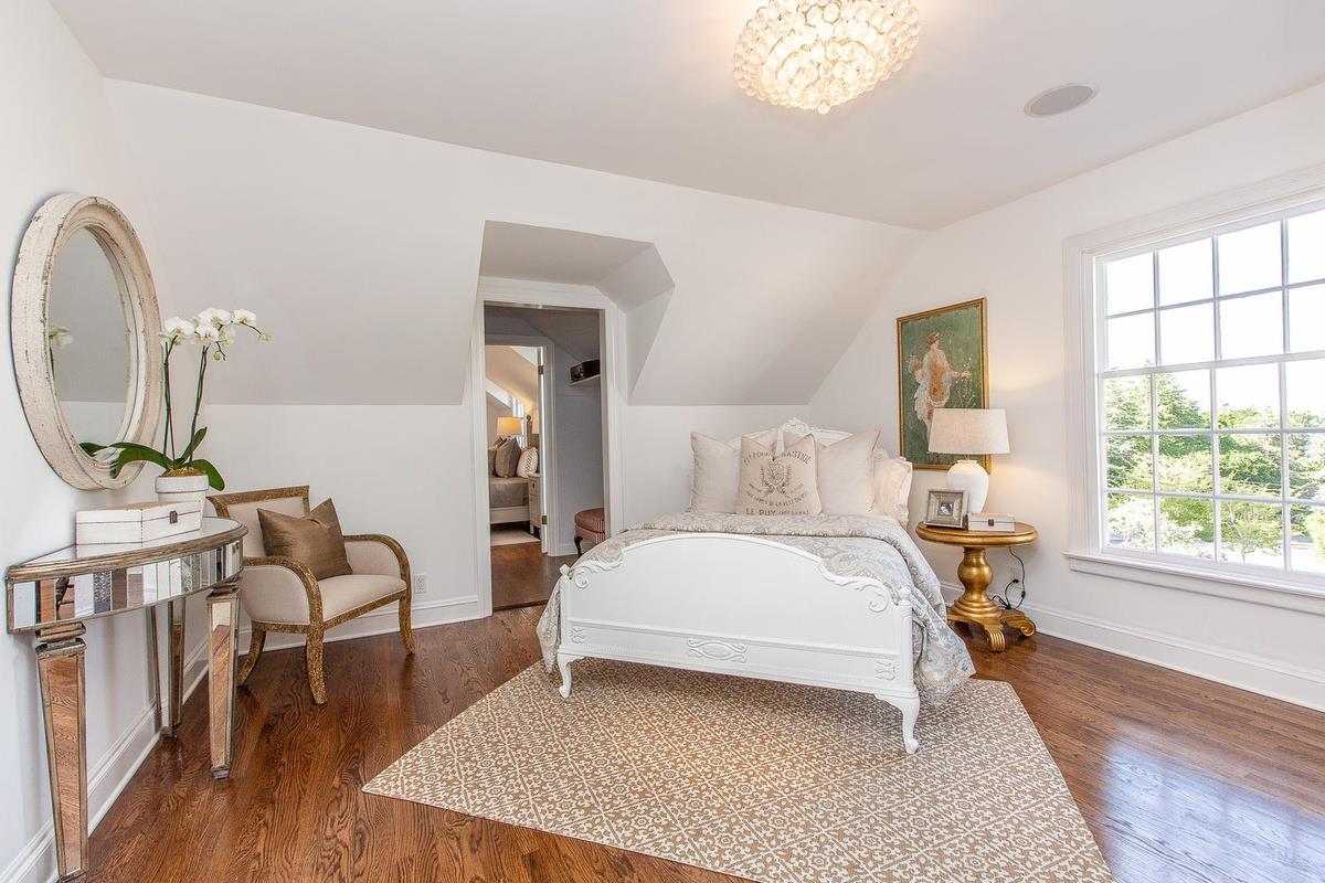 863 Chiltern Road Hillsborough, CA 94010 - Photo 32 of 50 a bedroom with a bed and wooden floor