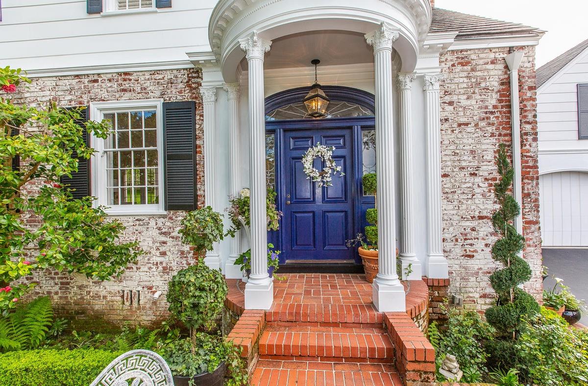 863 Chiltern Road Hillsborough, CA 94010 - Photo 4 of 50 a front view of a house with a porch