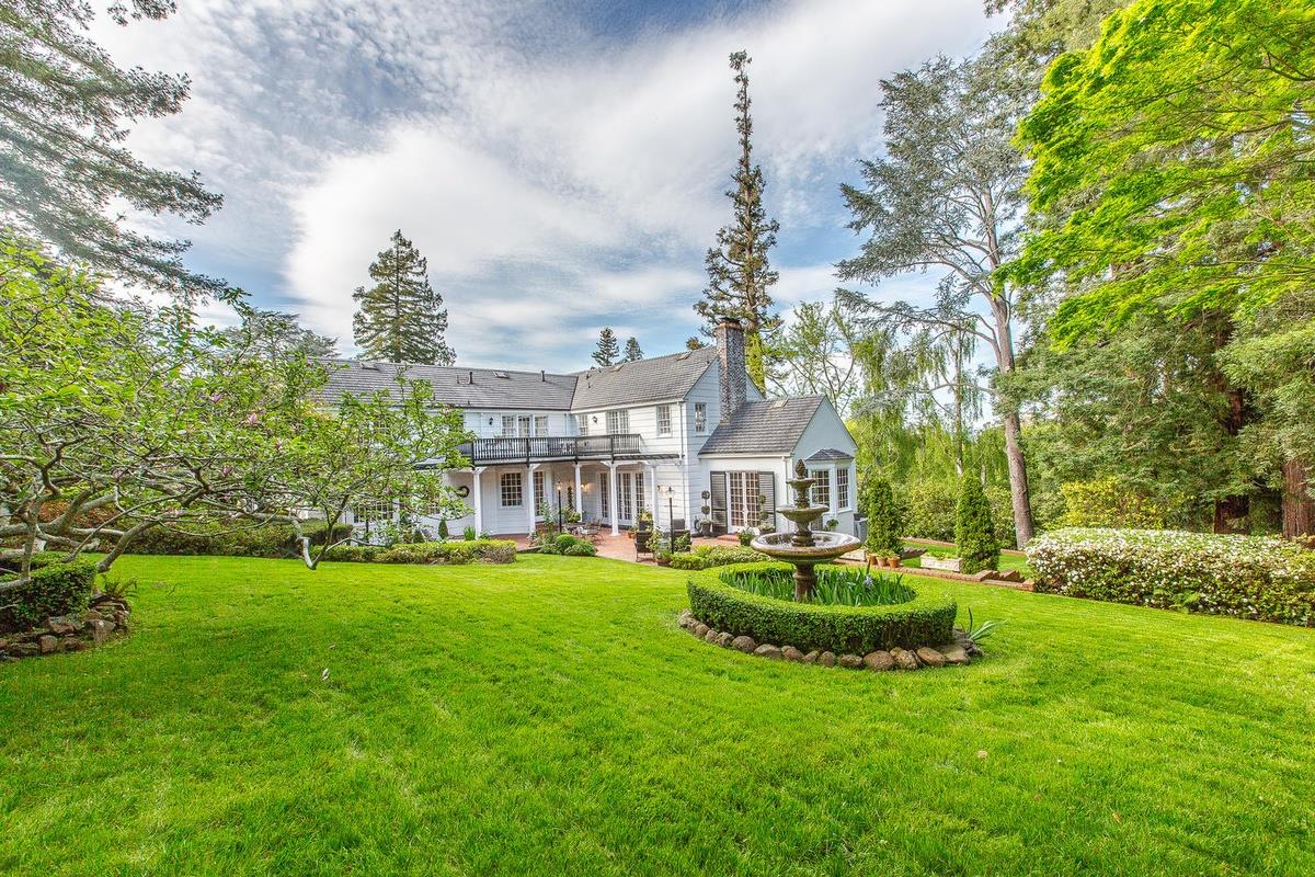 863 Chiltern Road Hillsborough, CA 94010 - Photo 41 of 50 a view of a house with a big yard and a fountain
