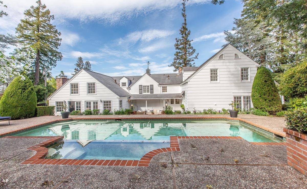 863 Chiltern Road Hillsborough, CA 94010 - Photo 45 of 50 a front view of a house with a yard and swimming pool