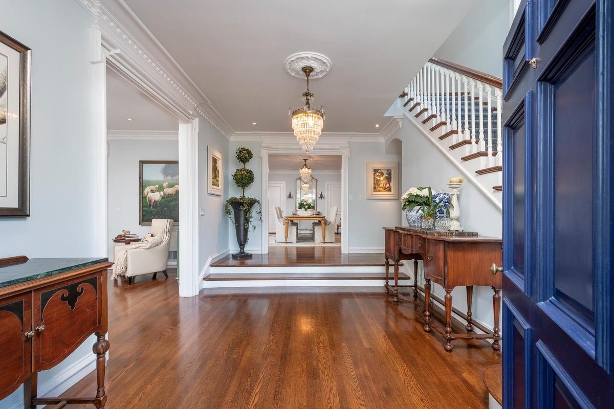863 Chiltern Road Hillsborough, CA 94010 - Photo 5 of 50 a view of an entryway with wooden floor windows and a chandelier