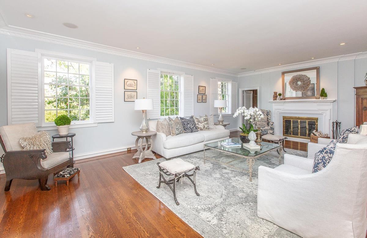 863 Chiltern Road Hillsborough, CA 94010 - Photo 7 of 50 a living room with furniture a fireplace and a table