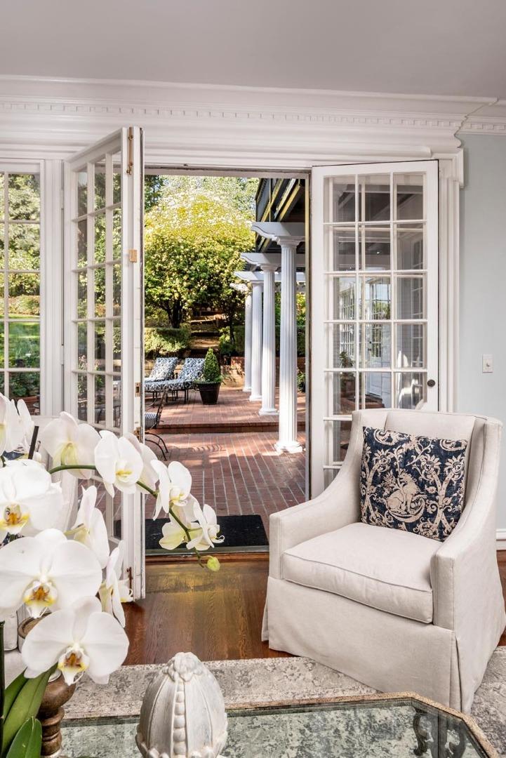 863 Chiltern Road Hillsborough, CA 94010 - Photo 10 of 50 a living room with furniture and a large window