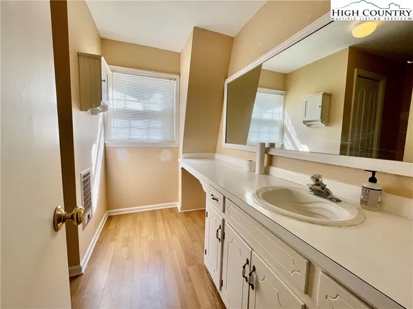 a view of a livingroom with a ceiling fan and window