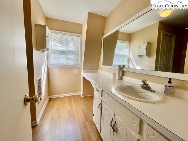 a view of a livingroom with a ceiling fan and window