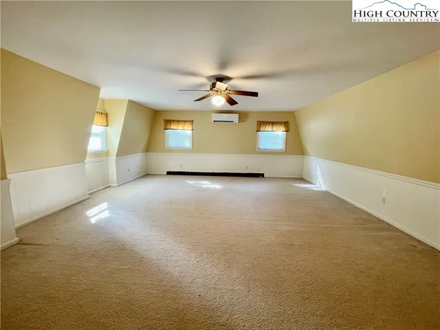 a room with window and furniture