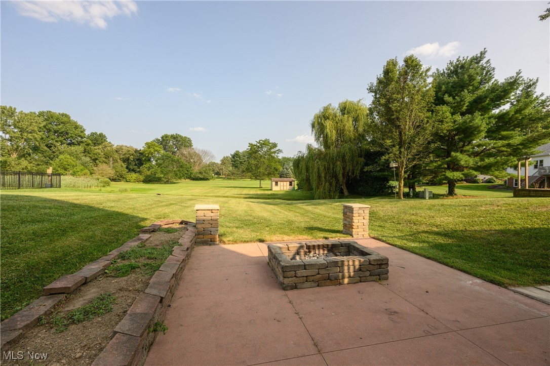 6986 Sweetwater Road Northeast Canton, OH 44721 - Photo 27 of 36 View of patio / terrace featuring a fire pit