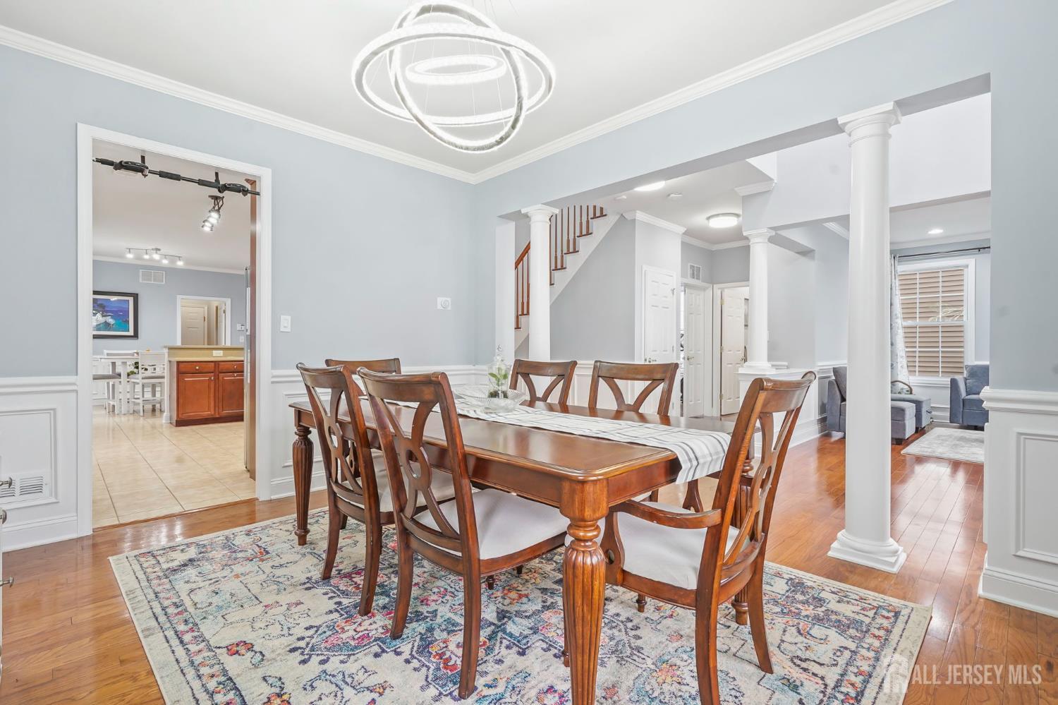 54 Harness Way Chesterfield, NJ 08515 - Photo 11 of 41 a dining room with furniture and wooden floor