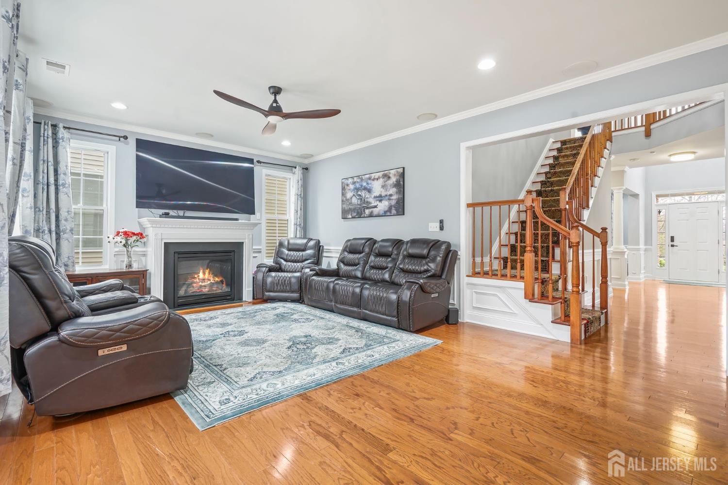 54 Harness Way Chesterfield, NJ 08515 - Photo 12 of 41 a living room with furniture fireplace and flat screen tv