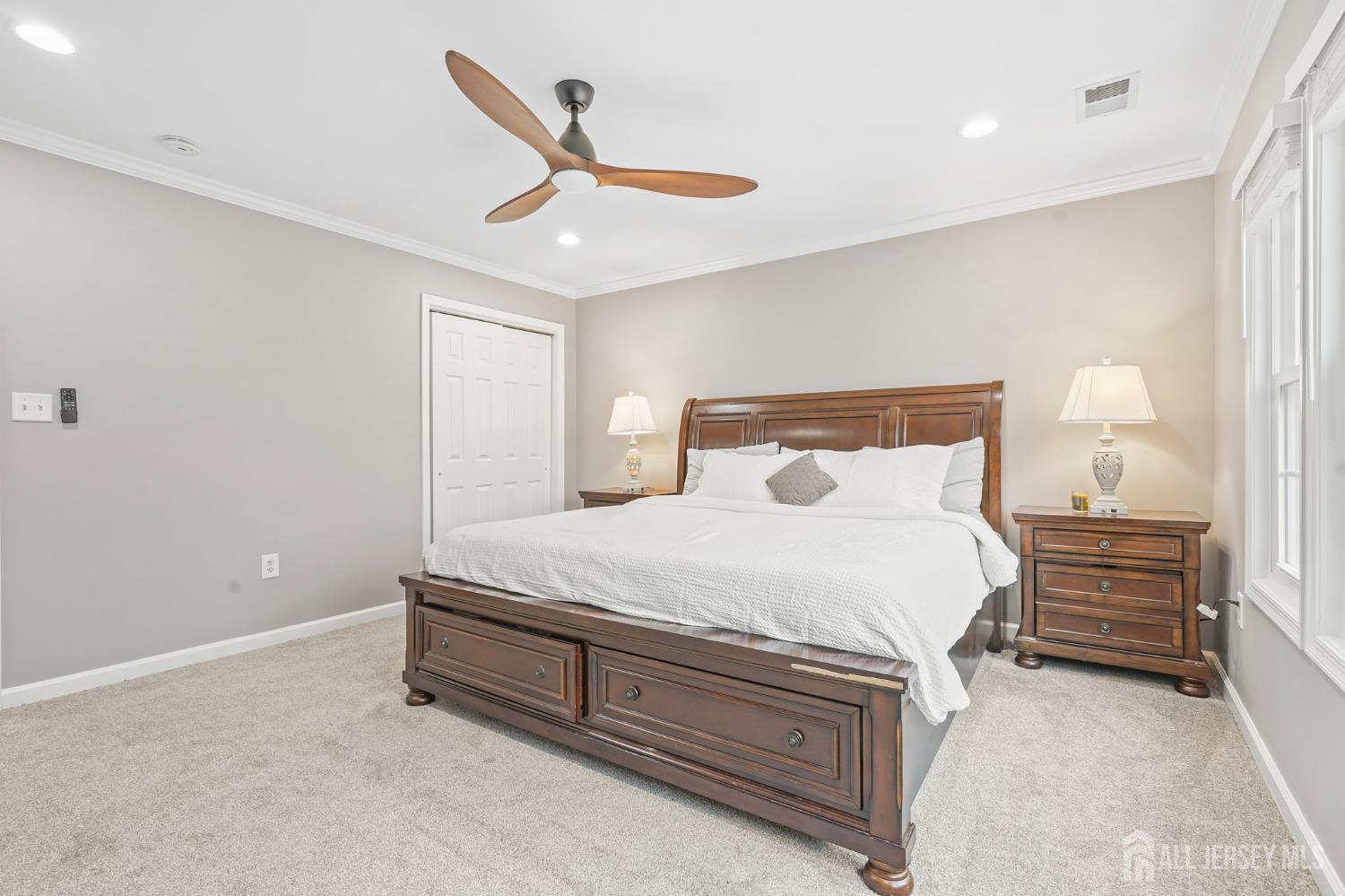 54 Harness Way Chesterfield, NJ 08515 - Photo 25 of 41 a spacious bedroom with a bed and a ceiling fan