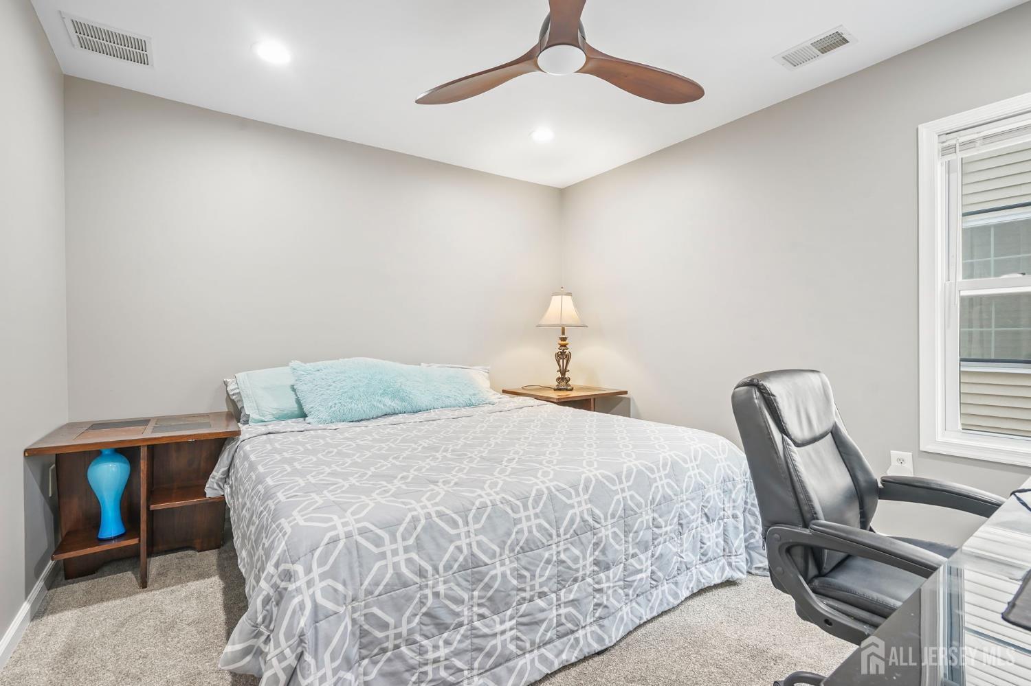 54 Harness Way Chesterfield, NJ 08515 - Photo 26 of 41 a bedroom with a bed desk and chair