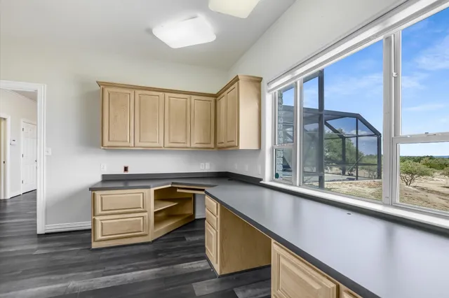 a kitchen with a sink and cabinets