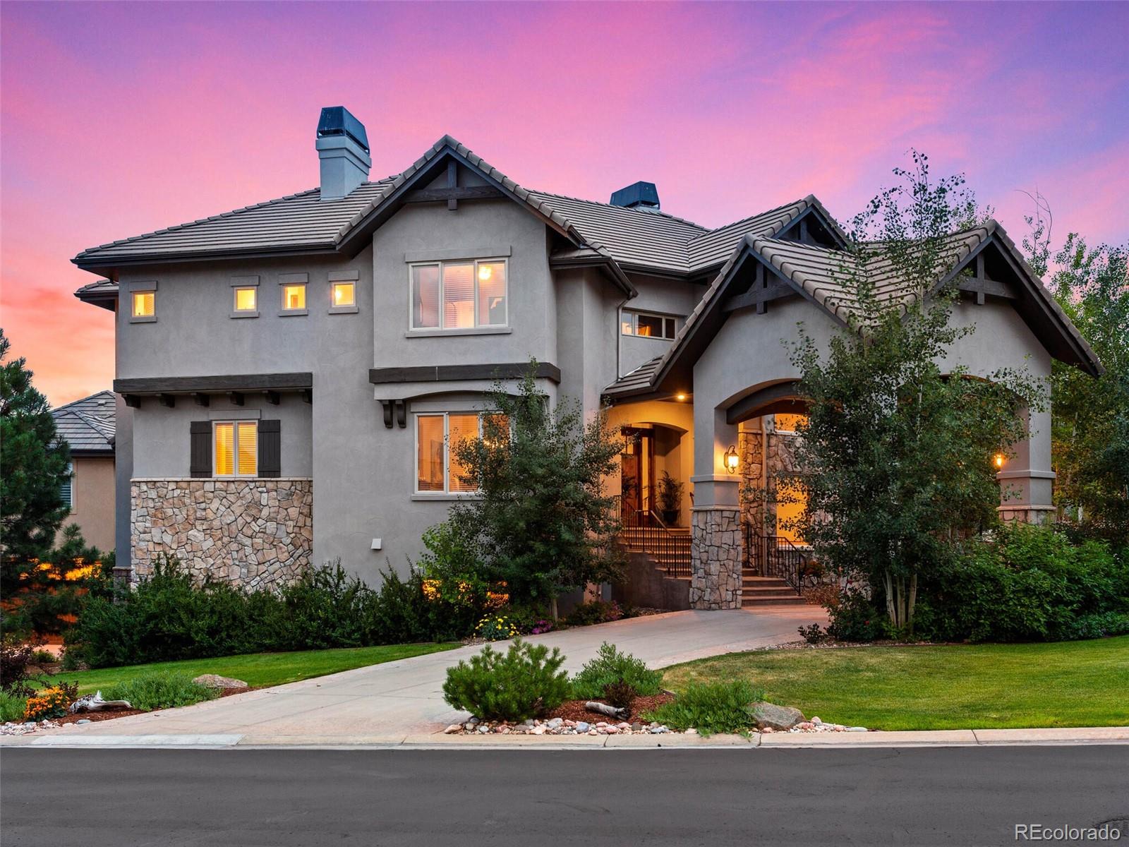 a front view of a house with garden
