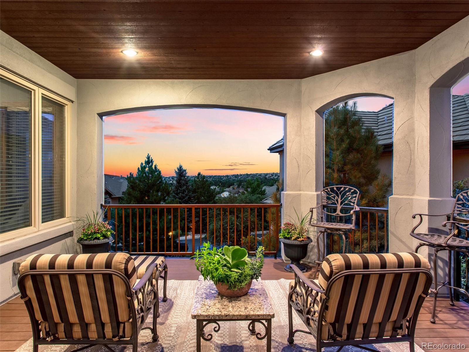 1176 Buffalo Ridge Road Castle Pines, CO 80108 - Photo 11 of 37 a outdoor living space with furniture and garden view