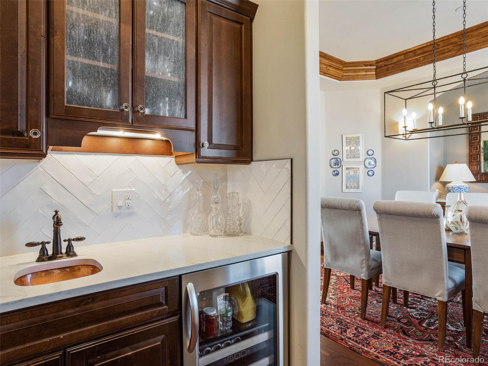 1176 Buffalo Ridge Road Castle Pines, CO 80108 - Photo 13 of 37 a backyard of a house with table and chairs