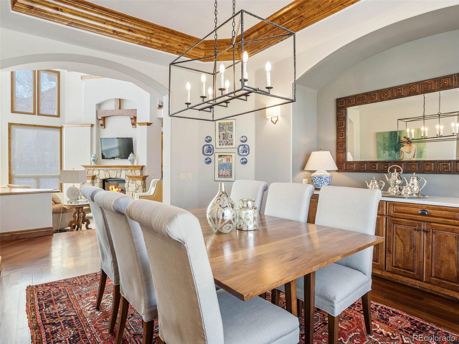 1176 Buffalo Ridge Road Castle Pines, CO 80108 - Photo 15 of 37 a view of a dining room with furniture
