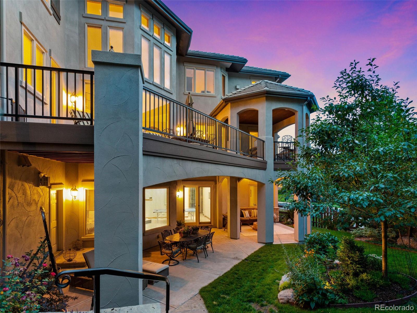 1176 Buffalo Ridge Road Castle Pines, CO 80108 - Photo 2 of 37 a front view of a house with a yard