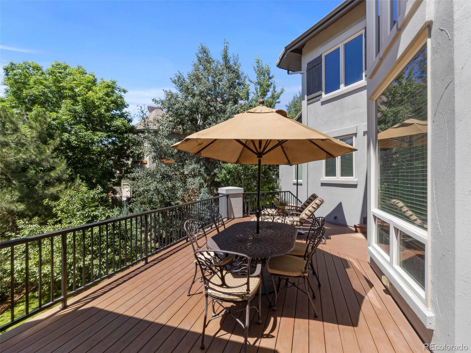 1176 Buffalo Ridge Road Castle Pines, CO 80108 - Photo 36 of 37 a view of balcony with two chairs and wooden floor