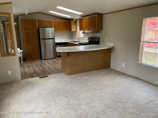 a kitchen with a sink a stove and refrigerator