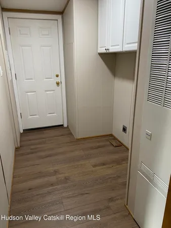 a kitchen with stainless steel appliances granite countertop a sink a stove a refrigerator a microwave a counter top and cabinets