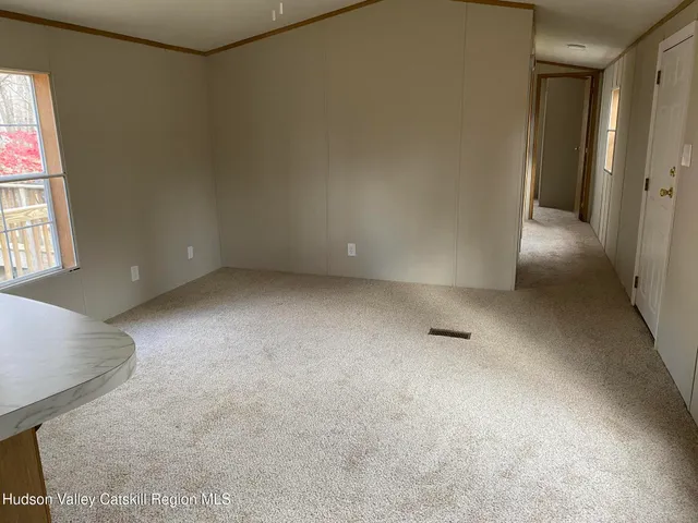 a view of a bathroom with a glass door and a toilet