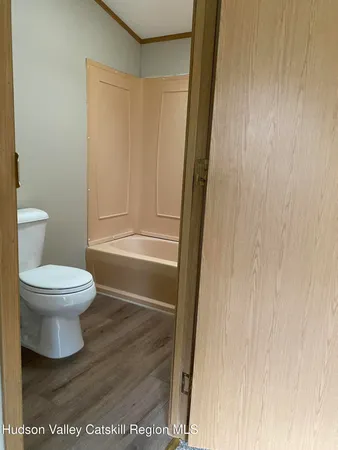 a view of a hallway with closet area
