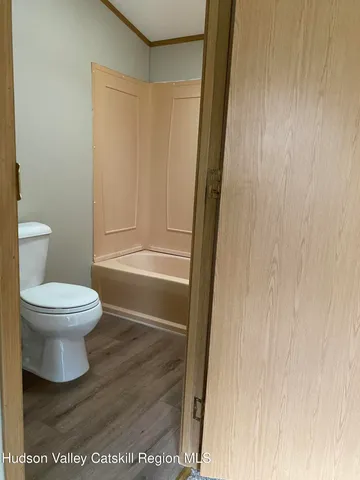 a view of a hallway with closet area