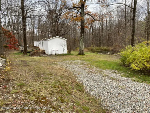 a backyard of a house with trees and outdoor space