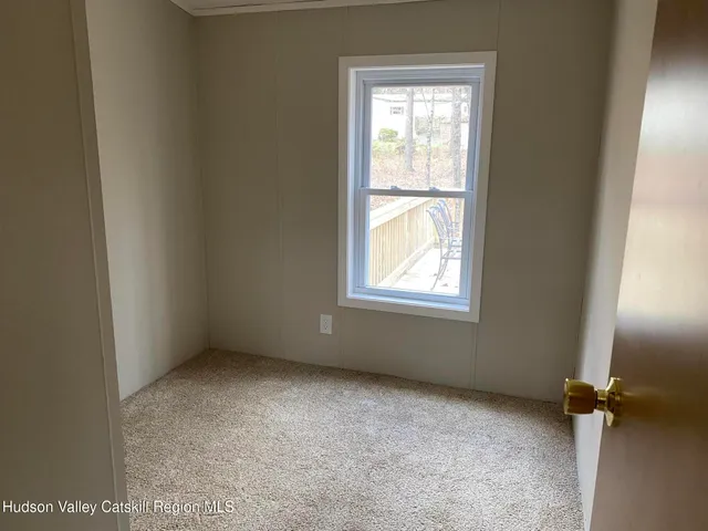a view of hallway with windows