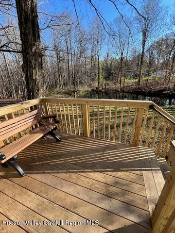 a view of outdoor space with deck and tree