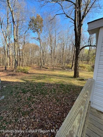 a view of a yard with trees