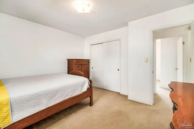 a view of a swimming pool with a yard