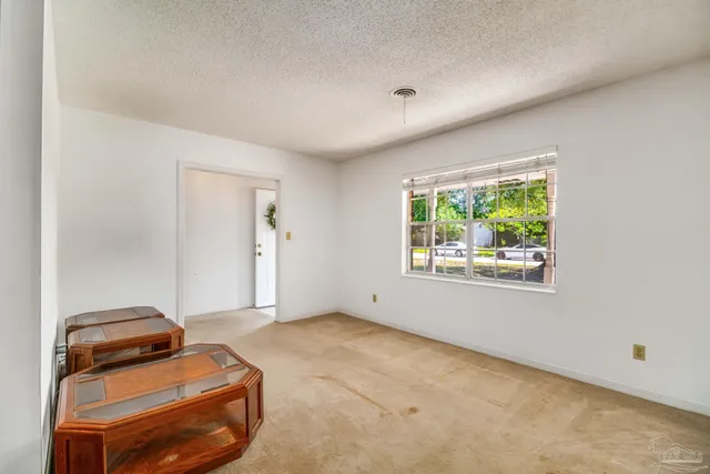 a room with furniture and a flat screen tv