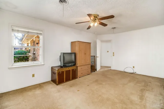 a kitchen with a stove and a refrigerator