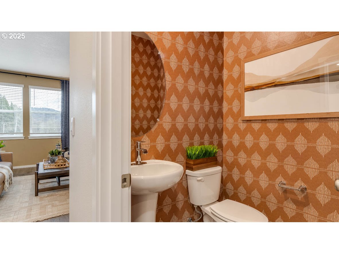 9266 Southeast Middleton Street Happy Valley, OR 97086 - Photo 2 of 14 a bathroom with a toilet and a rug