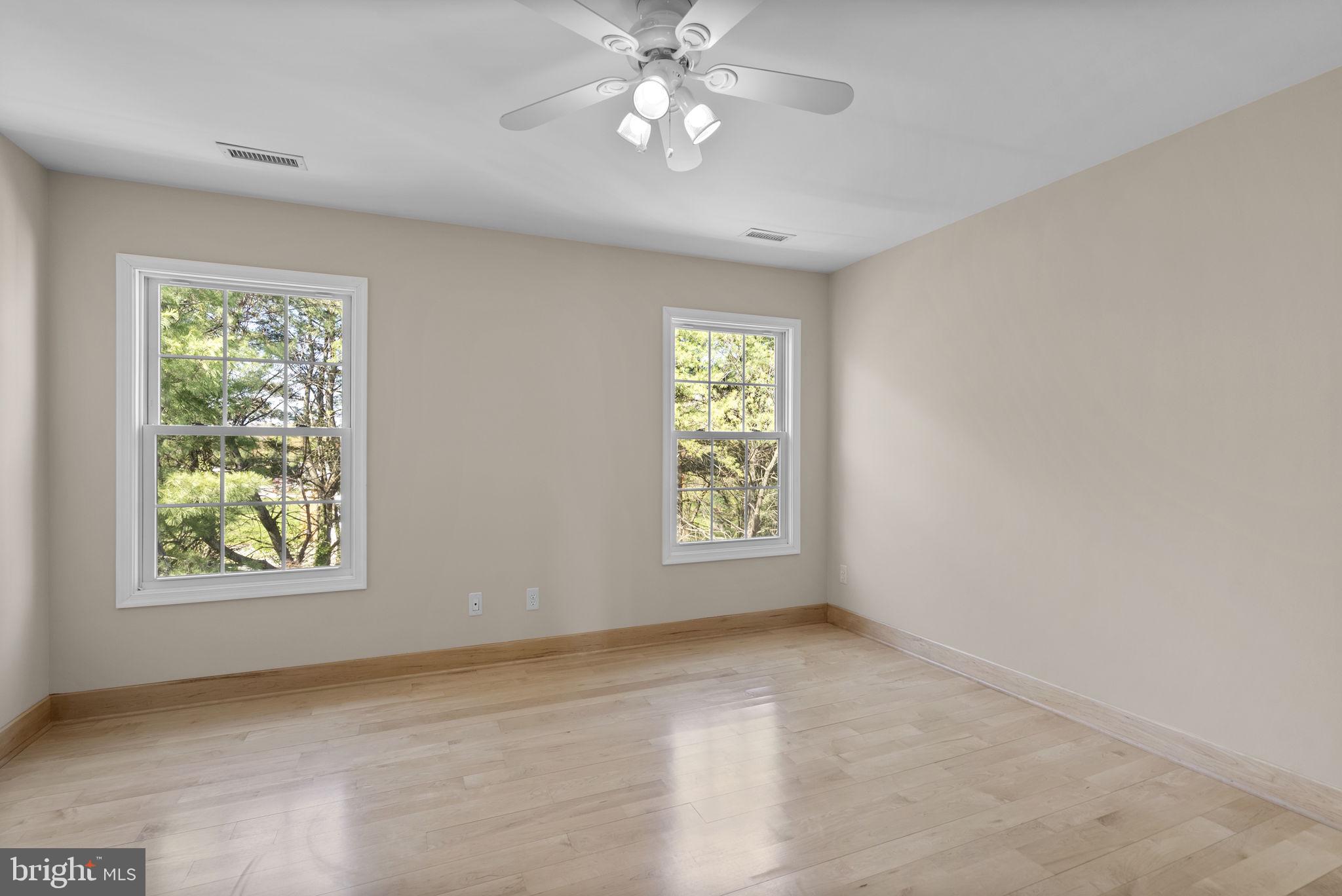 1304 Hill Born Drive Hanover, MD 21076 - Photo 17 of 47 an empty room with windows and ceiling fan