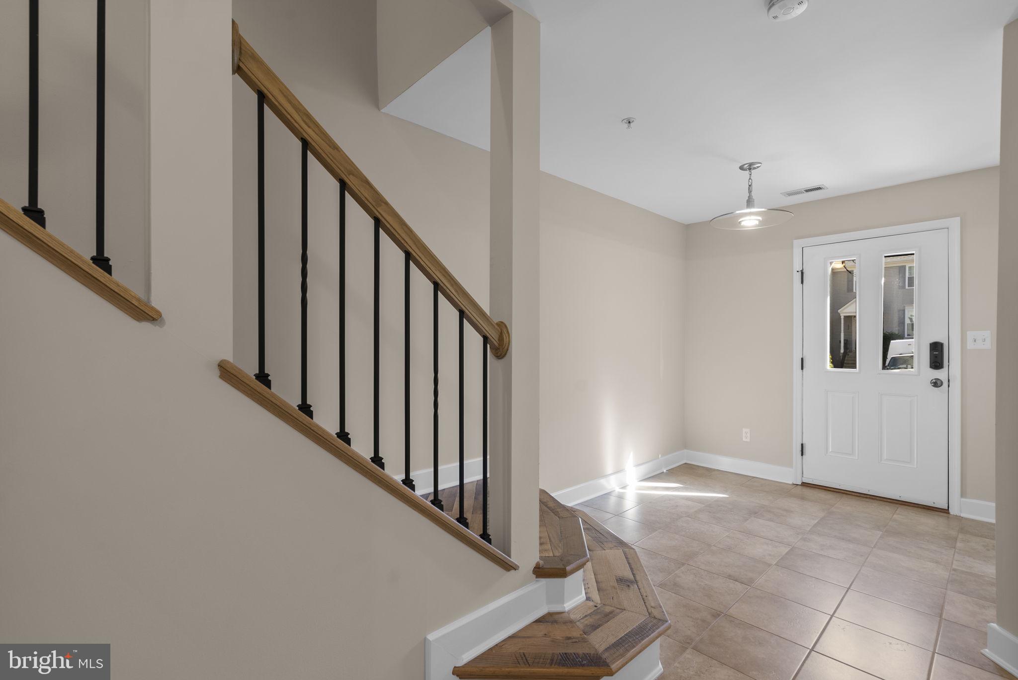 1304 Hill Born Drive Hanover, MD 21076 - Photo 2 of 47 a view of a hallway with wooden floor and entryway