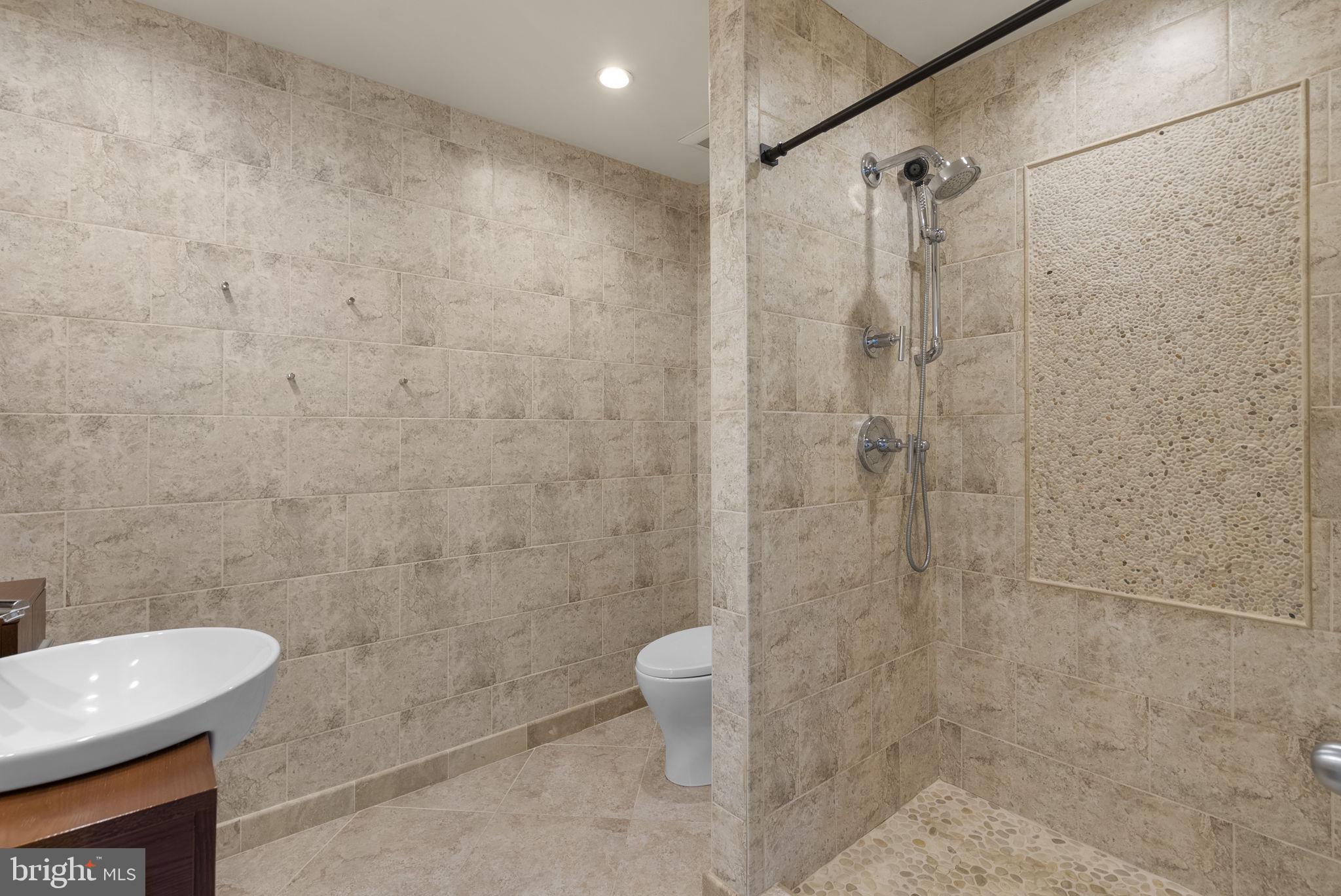 1304 Hill Born Drive Hanover, MD 21076 - Photo 21 of 47 a bathroom with a shower and a toilet