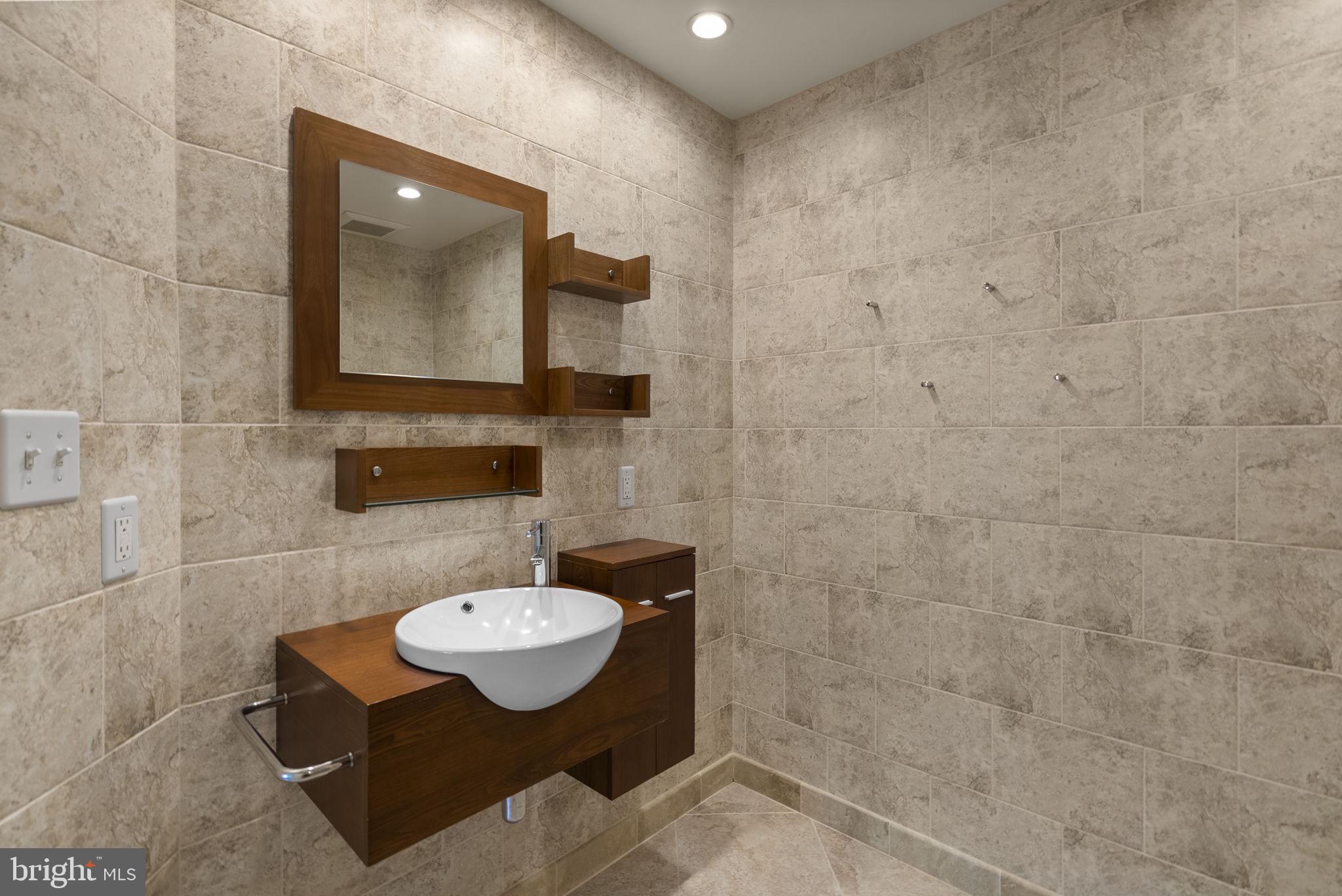 1304 Hill Born Drive Hanover, MD 21076 - Photo 22 of 47 a bathroom with a sink mirror and a toilet