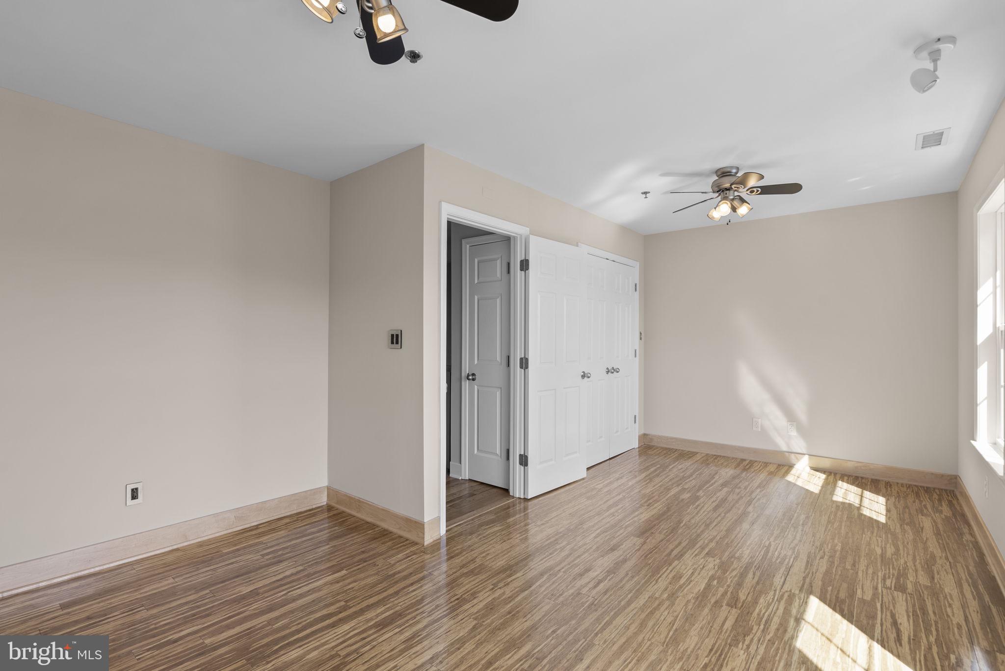 1304 Hill Born Drive Hanover, MD 21076 - Photo 25 of 47 wooden floor in an empty room with a window