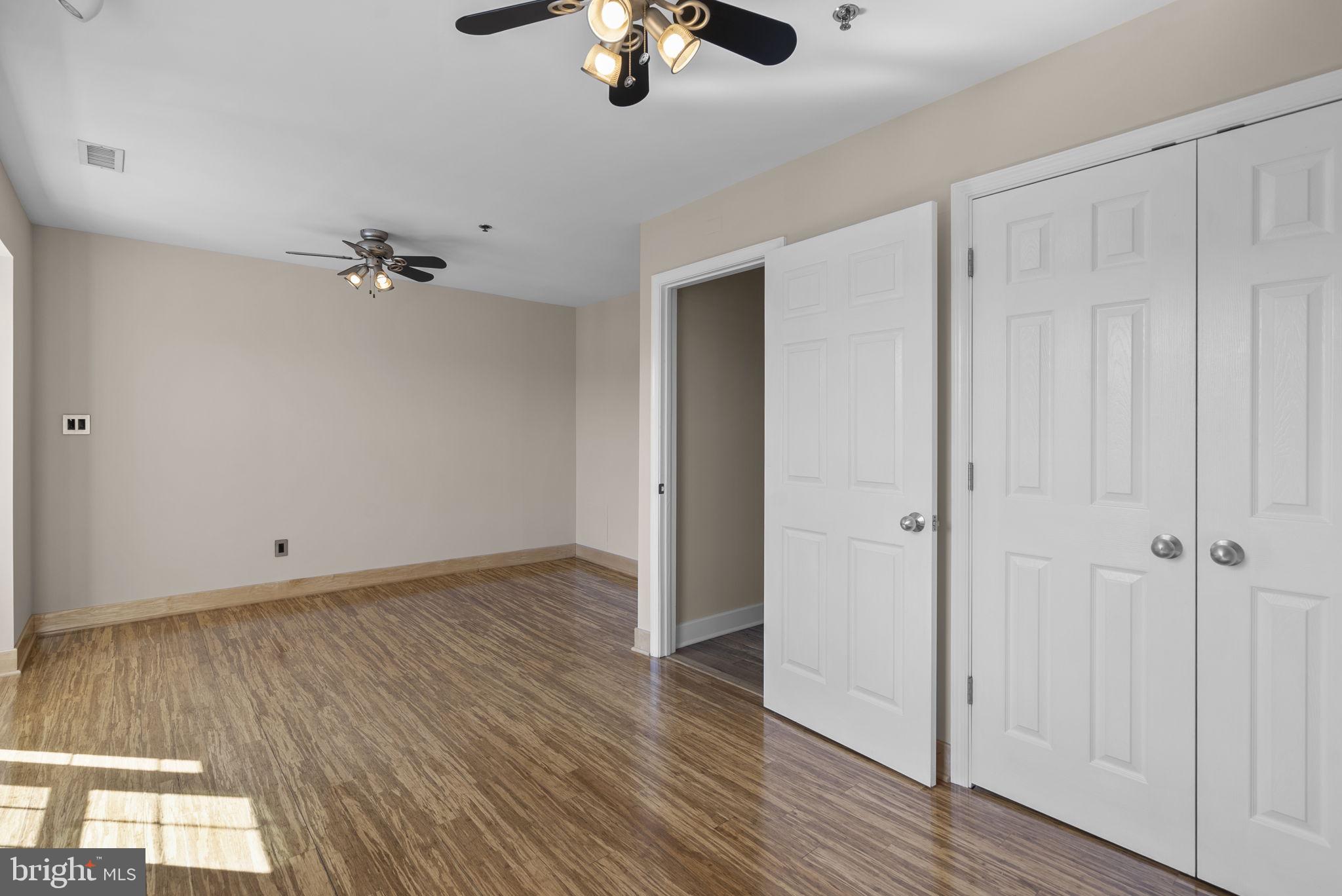 1304 Hill Born Drive Hanover, MD 21076 - Photo 26 of 47 wooden floor in an empty room with a window