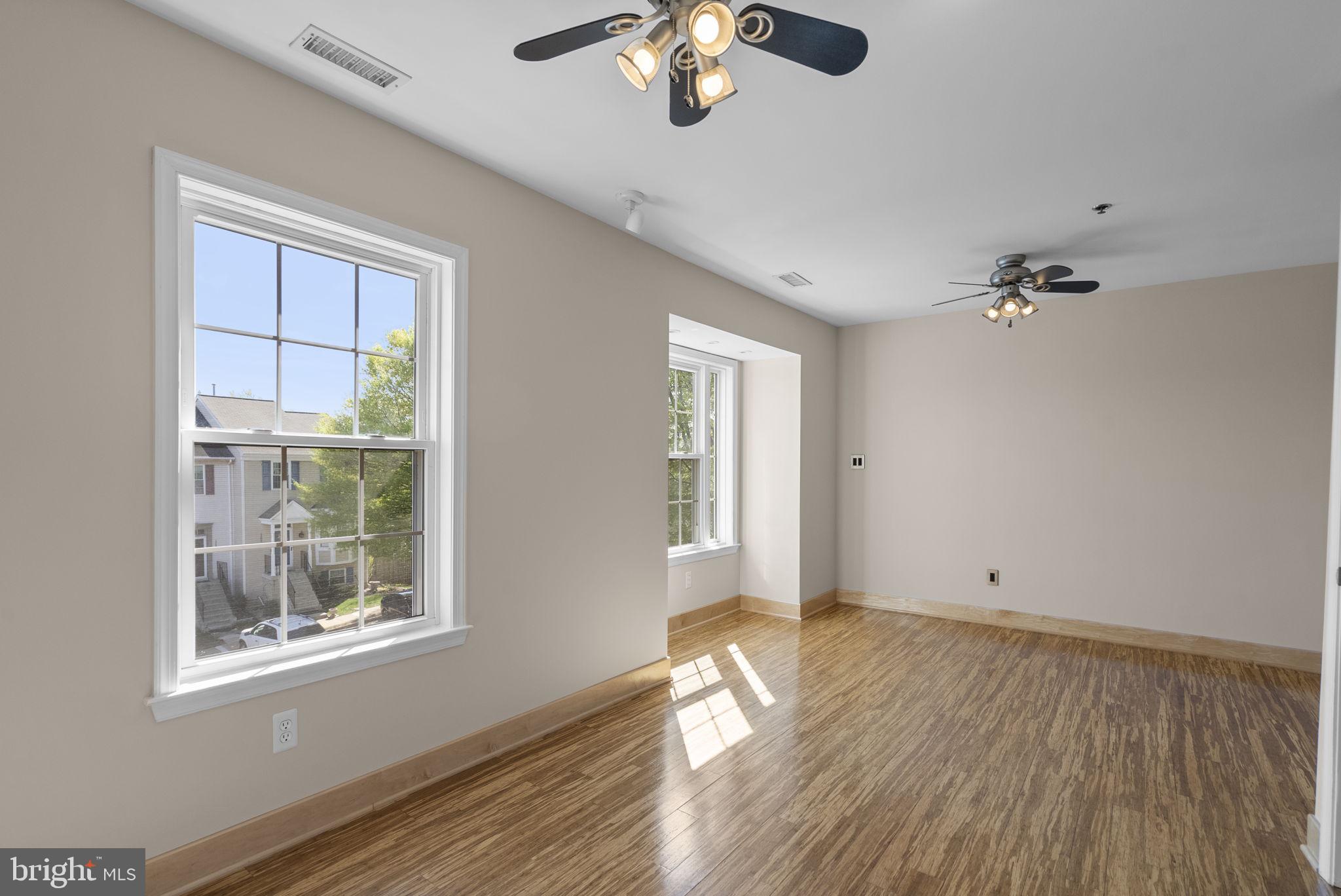 1304 Hill Born Drive Hanover, MD 21076 - Photo 27 of 47 a view of empty room with wooden floor and fan
