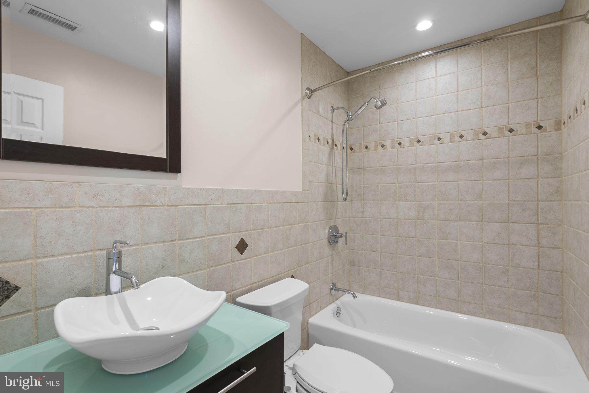 1304 Hill Born Drive Hanover, MD 21076 - Photo 29 of 47 a bathroom with a sink a toilet and bathtub